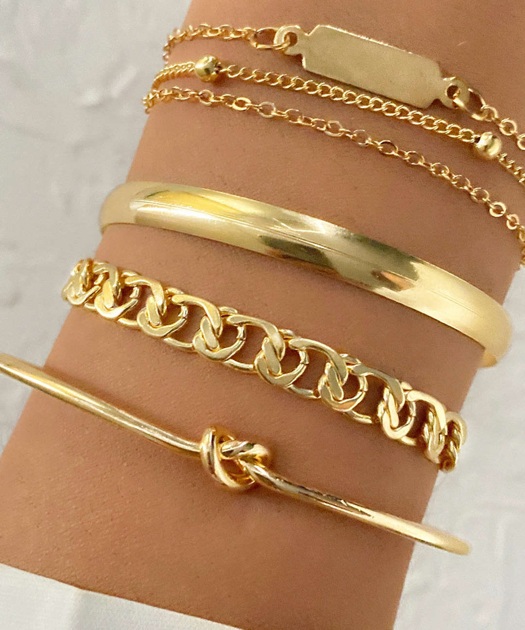Set de bracelets – 4 chaînes métalliques dorées
